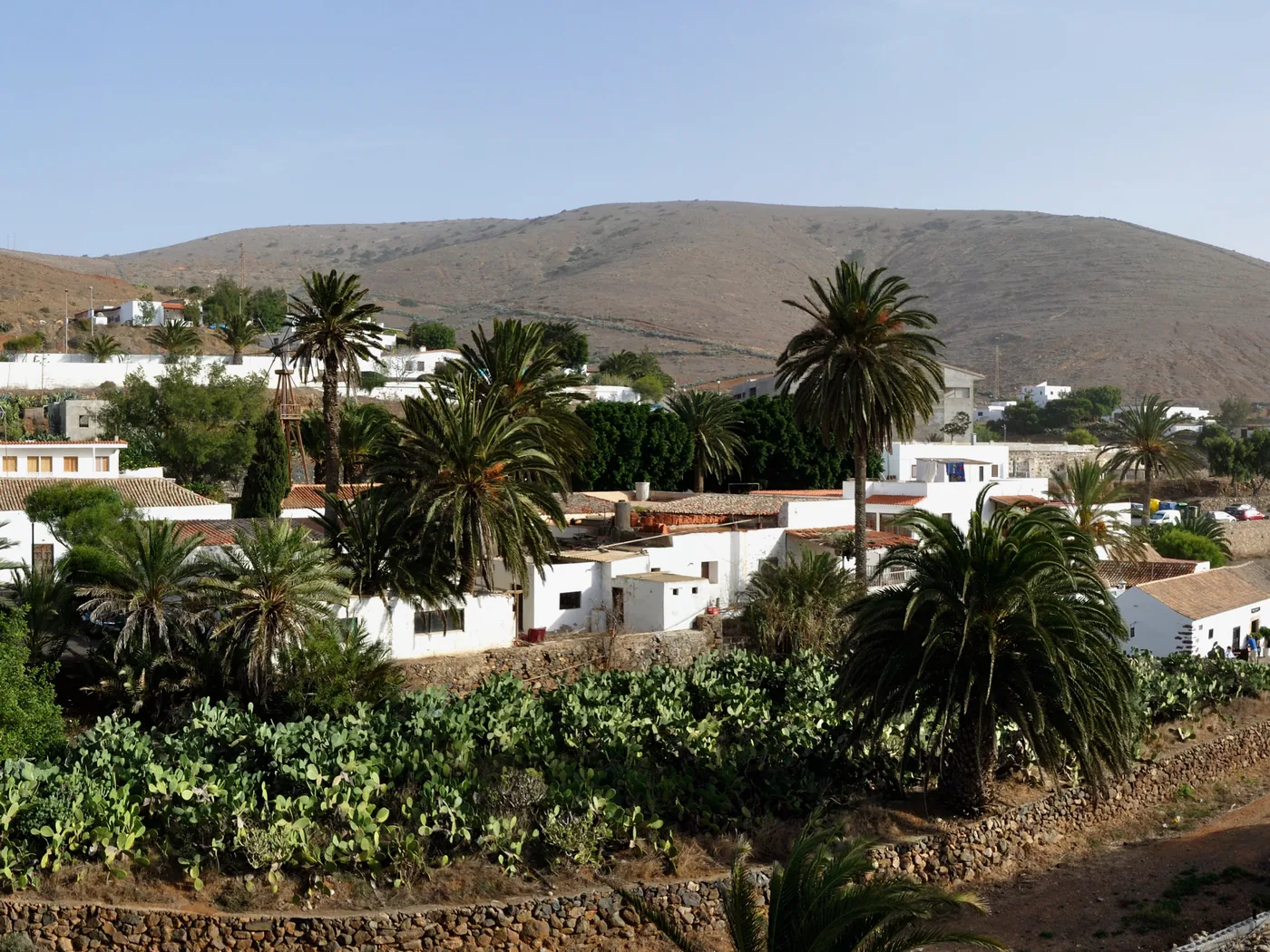 The whitewashed village of Betancuria nestled among palm trees in a mountain valley, Fuerteventura