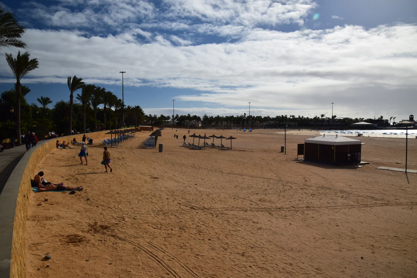 Sunbeds and parasols along the beach promenade at Playa del Castillo, Caleta de Fuste