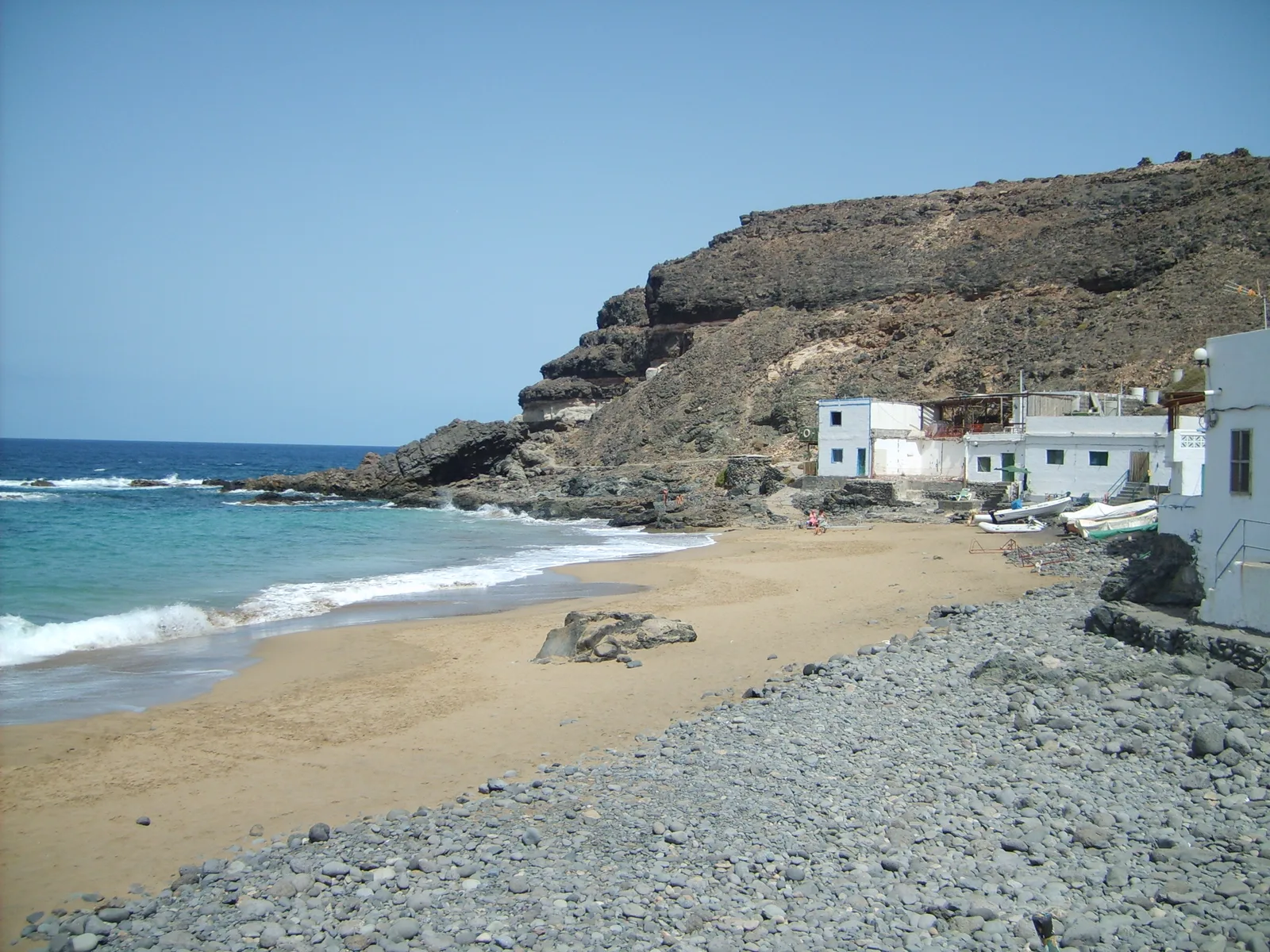 The small white fishing houses of Los Molinos beside the cove beach
